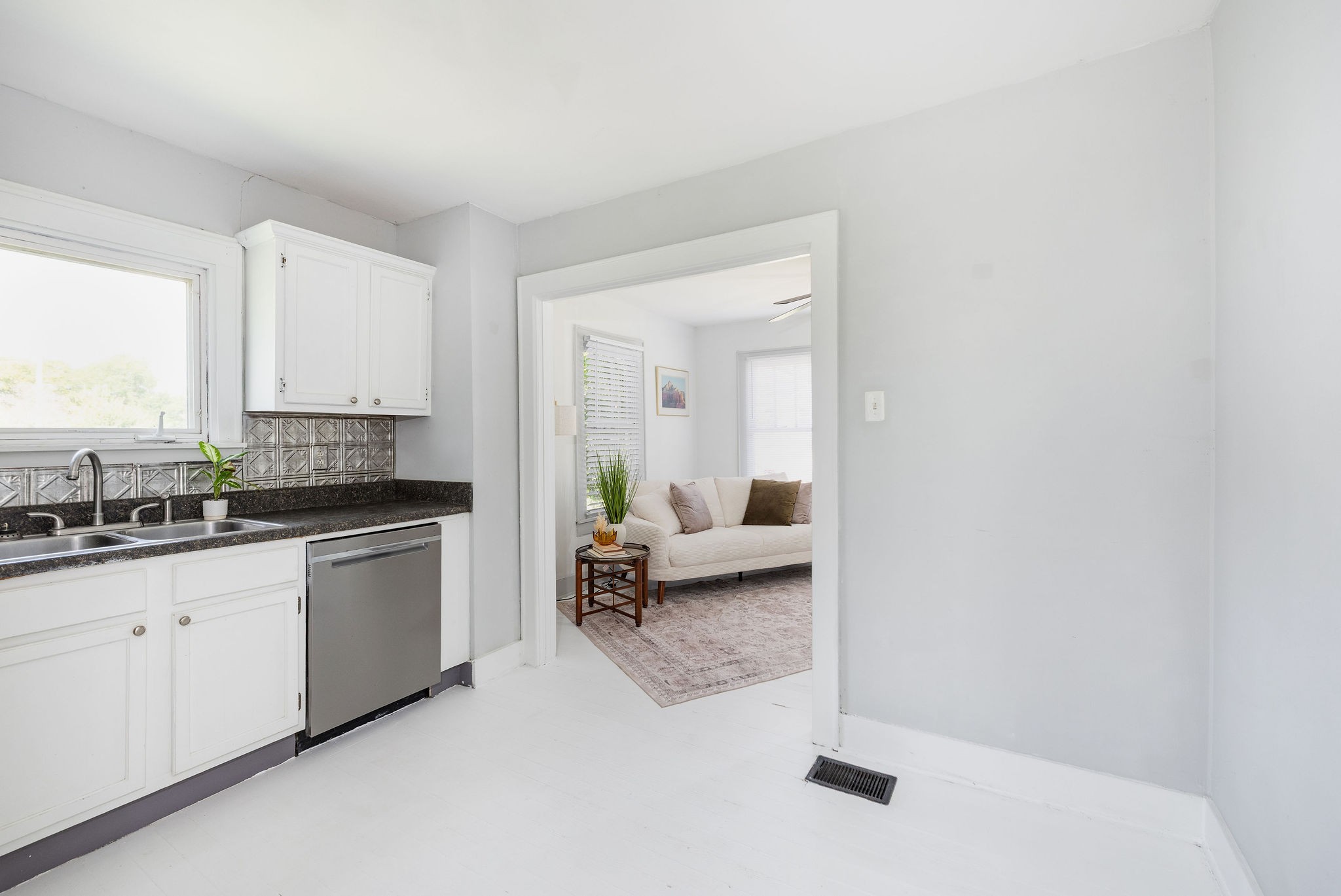 320 Cherry Street Madison, TN 37115 - Photo 12 of 30 a kitchen with granite countertop a sink and white cabinets