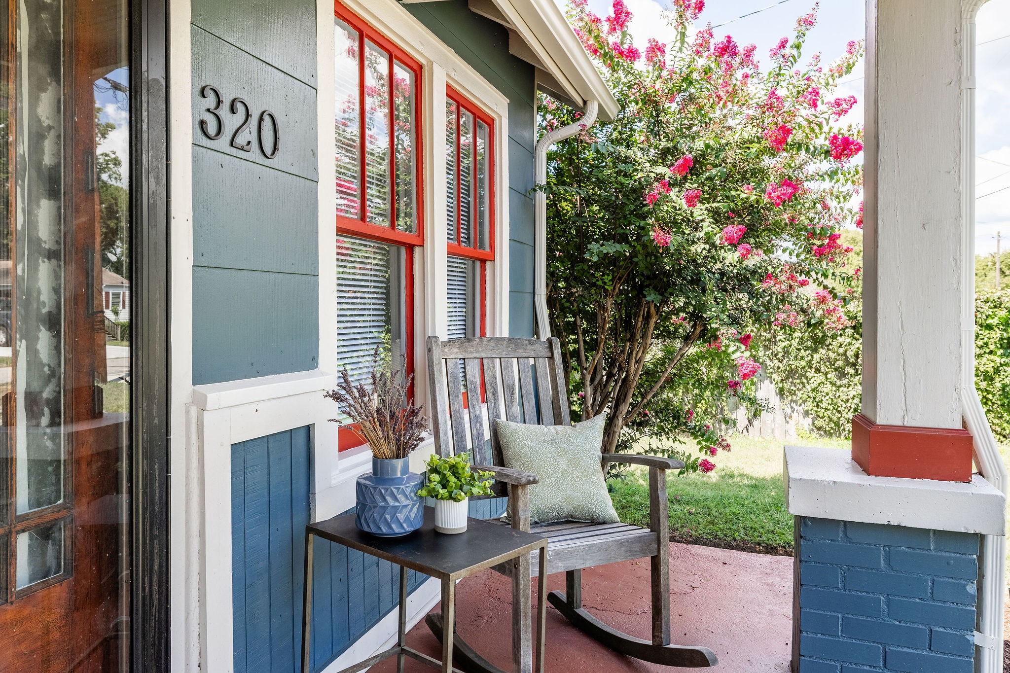 320 Cherry Street Madison, TN 37115 - Photo 2 of 30 a front view of a house with outdoor seating and flowers