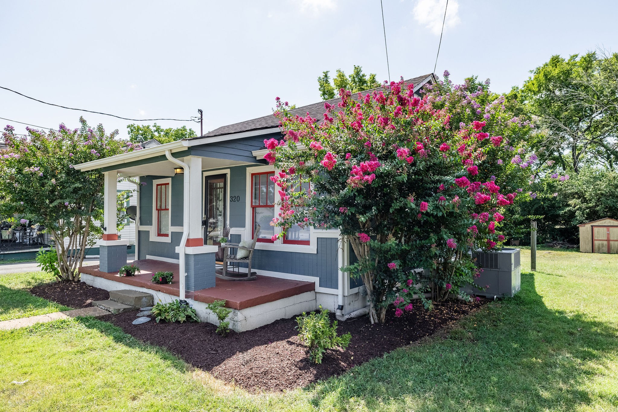 320 Cherry Street Madison, TN 37115 - Photo 27 of 30 a view of a house with backyard sitting area and garden