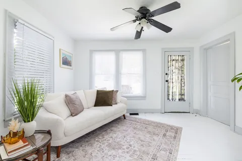 a living room with furniture and a window