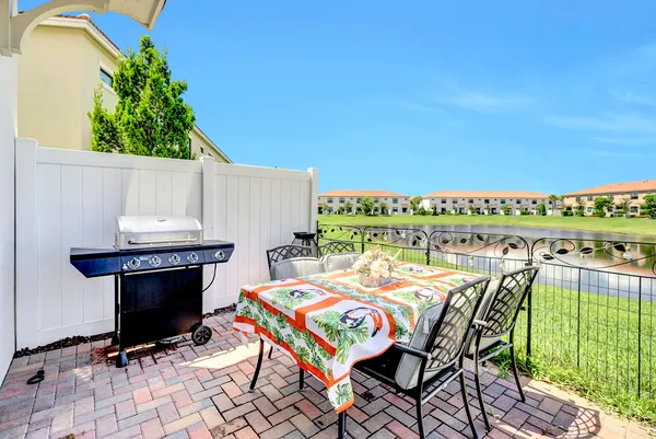 a view of a chairs and table in patio