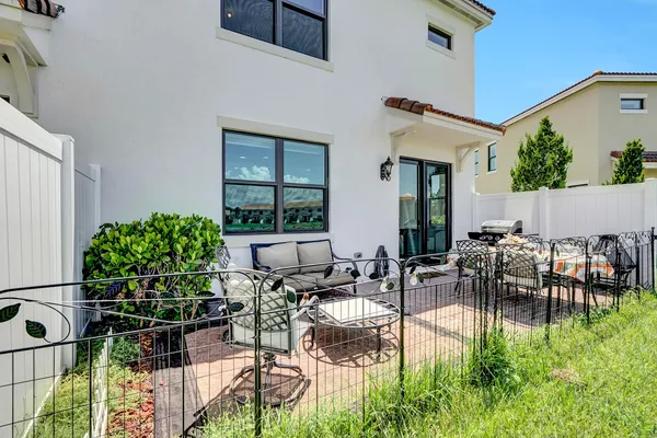 a view of dinning table and chairs in patio