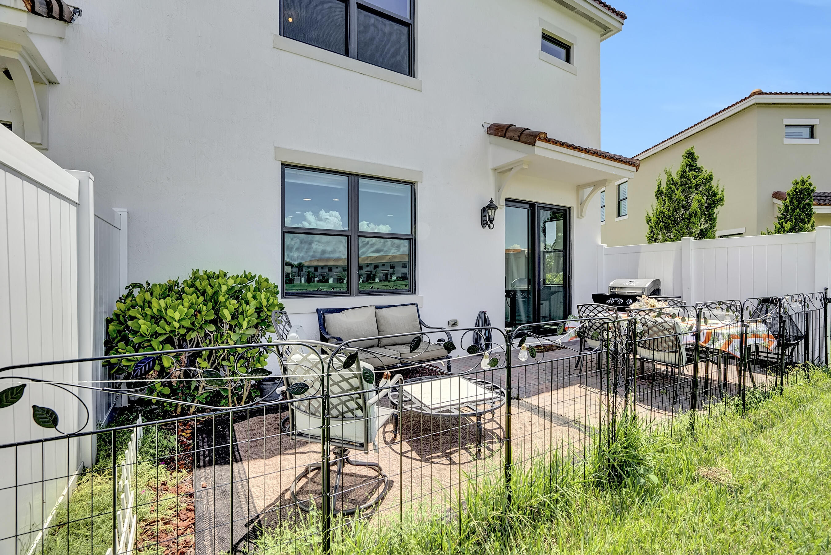 10043 Akenside Drive Boca Raton, FL 33428 - Photo 18 of 30 a view of dinning table and chairs in patio