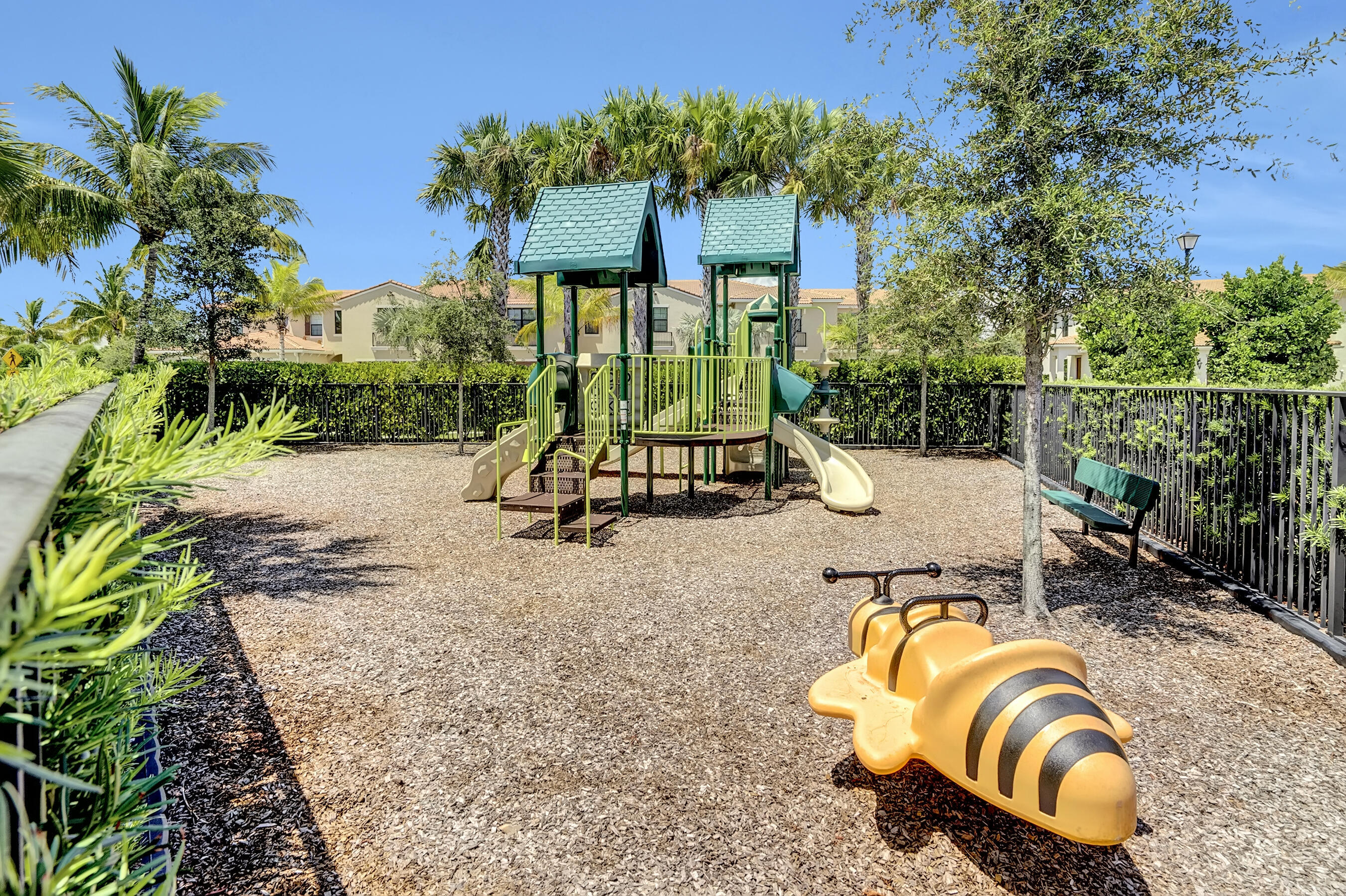 10043 Akenside Drive Boca Raton, FL 33428 - Photo 21 of 30 a view of a swimming pool with a patio and a garden