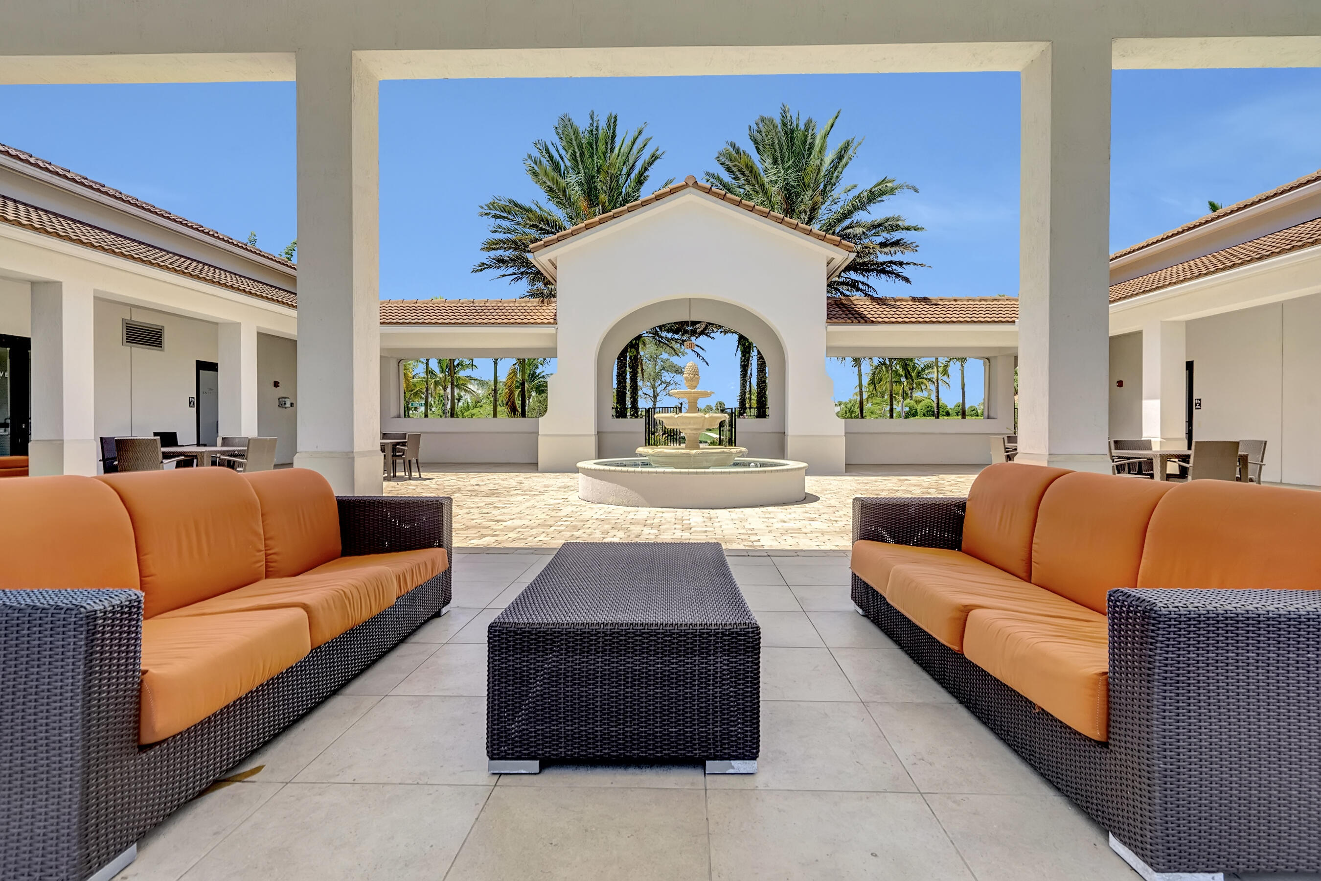 10043 Akenside Drive Boca Raton, FL 33428 - Photo 22 of 30 a living room with furniture fireplace and a large window