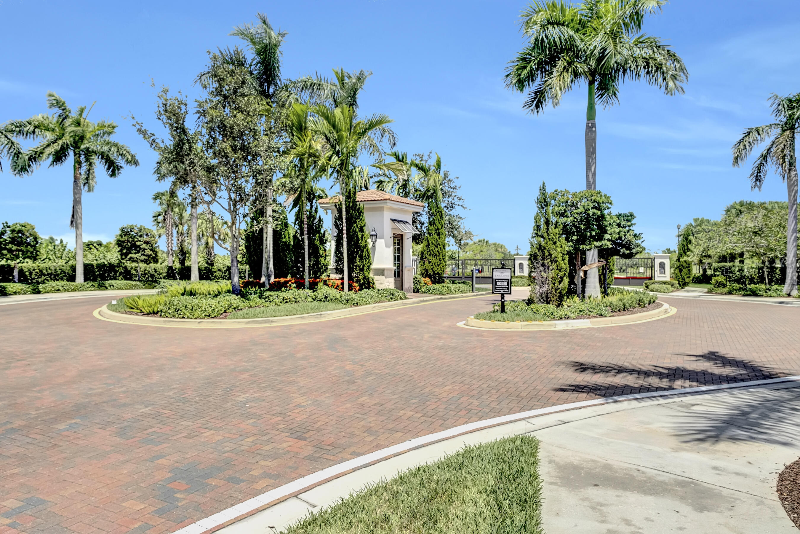 10043 Akenside Drive Boca Raton, FL 33428 - Photo 30 of 30 front view of a house with a yard and palm trees