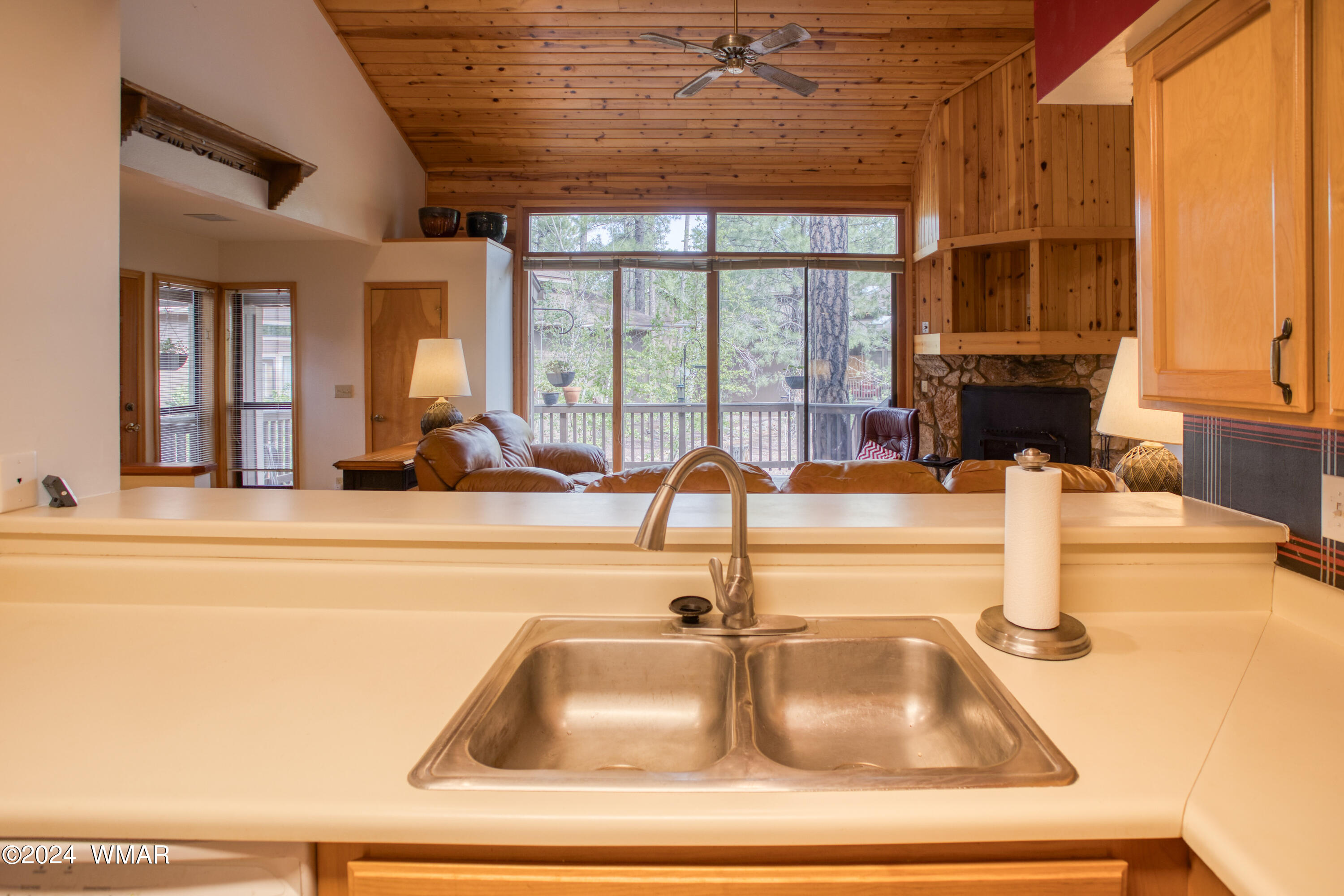 2727 Juniper Circle, Unit 37 Pinetop, AZ 85935 - Photo 11 of 33 a kitchen with kitchen island a sink and a window