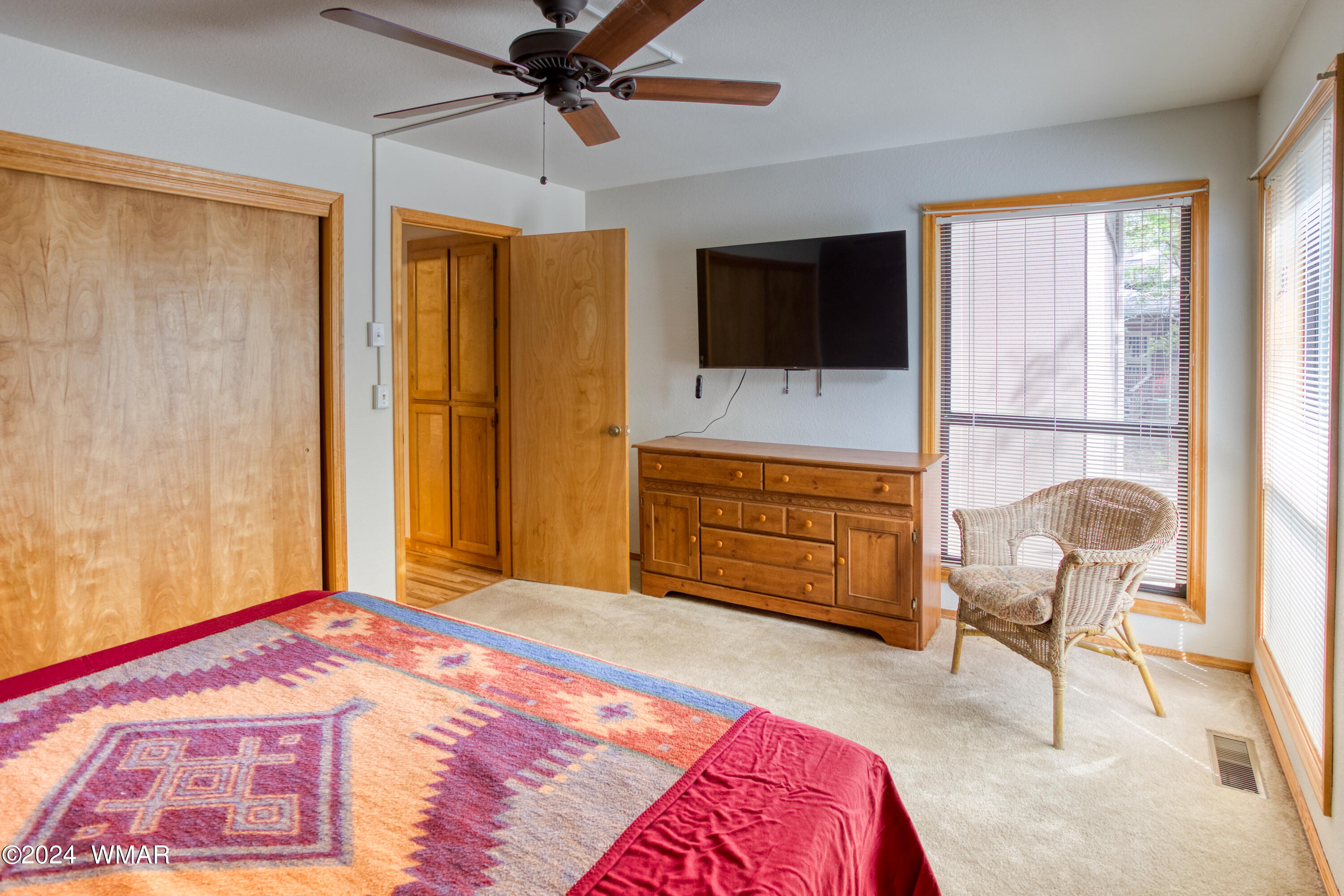 2727 Juniper Circle, Unit 37 Pinetop, AZ 85935 - Photo 13 of 33 a bedroom with a bed and a chair with the outer view
