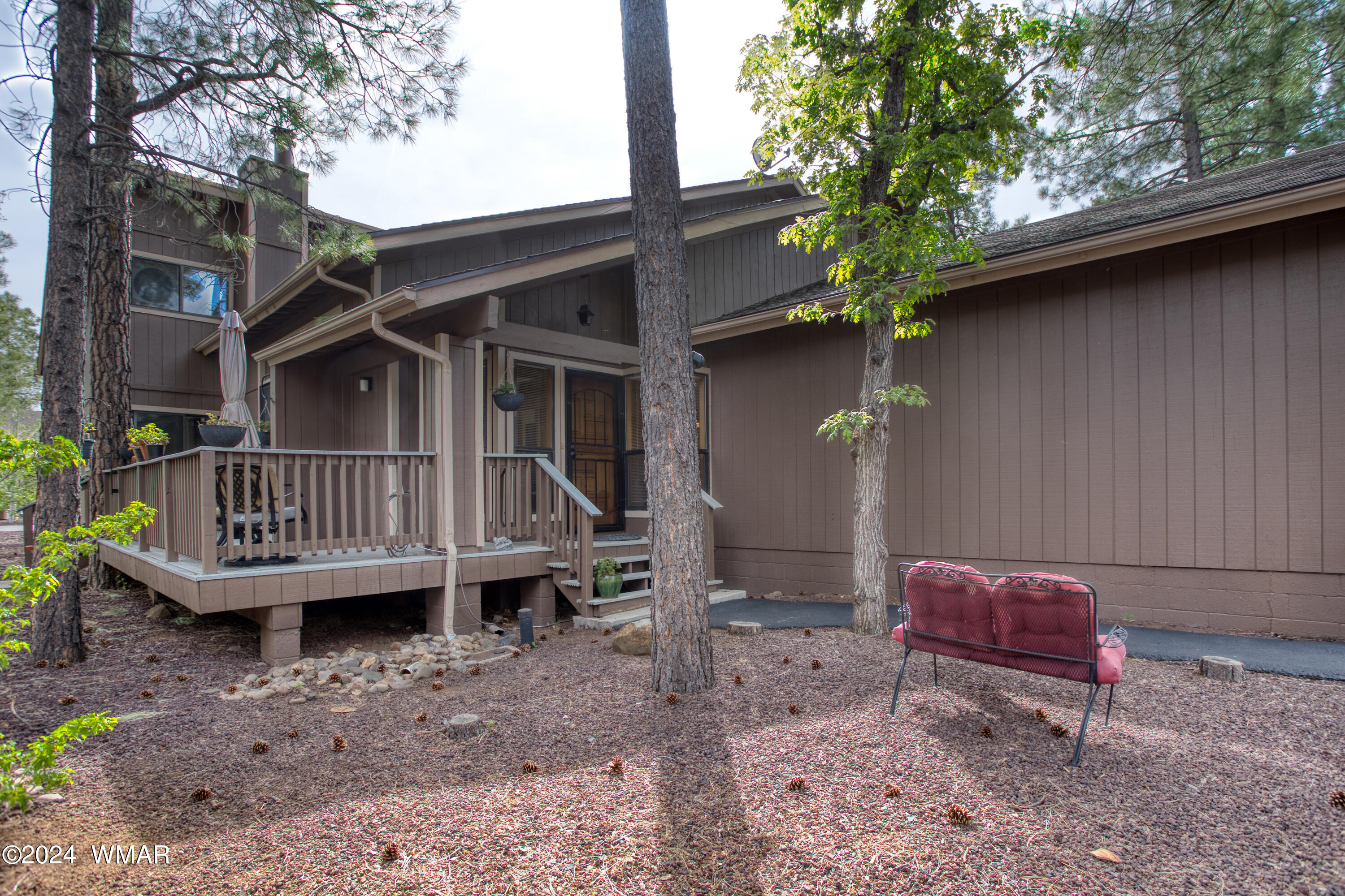 2727 Juniper Circle, Unit 37 Pinetop, AZ 85935 - Photo 29 of 33 a view of a deck with a table and chairs and a barbeque