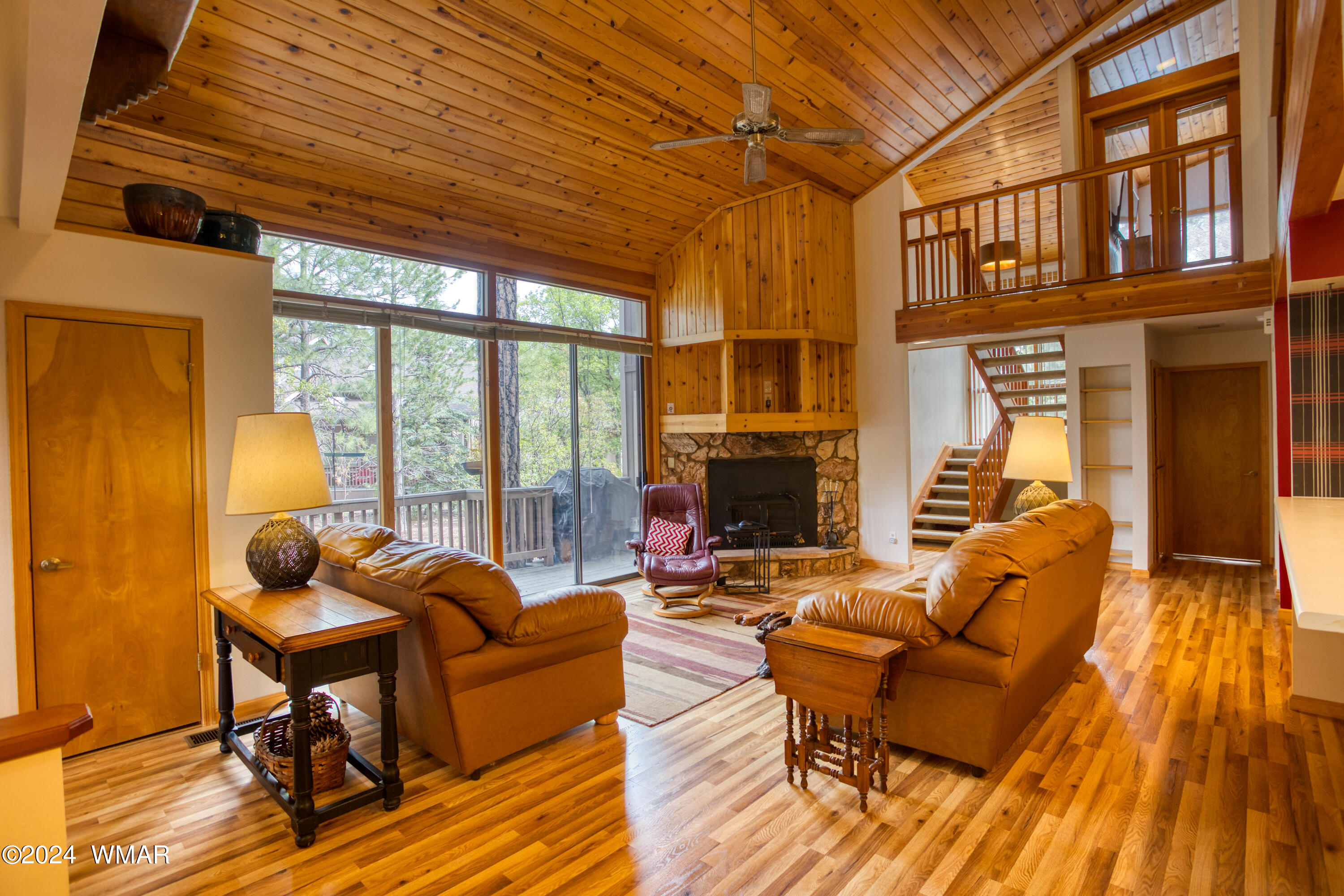 2727 Juniper Circle, Unit 37 Pinetop, AZ 85935 - Photo 5 of 33 a living room with fireplace furniture and a wooden floor