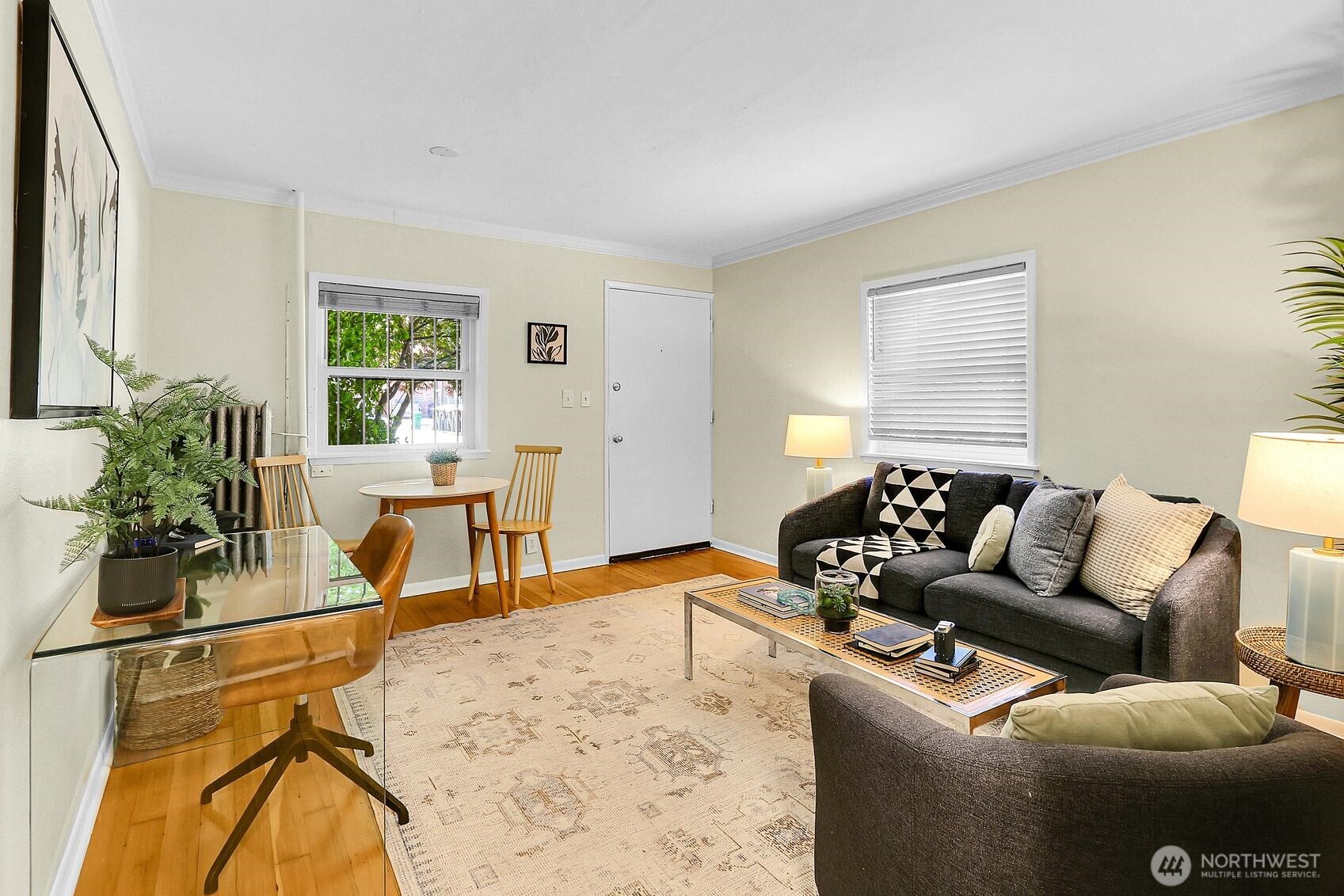 516 East Thomas Street, Unit 105 Seattle, WA 98102 - Photo 3 of 15 a living room with furniture a window and potted plant