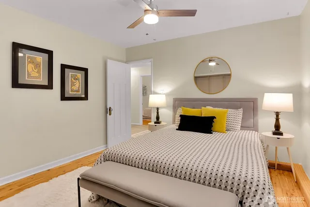 a bedroom with a bed and lamp