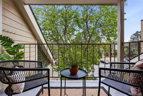 a backyard of a house with table and chairs