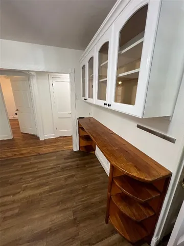 a room with wooden floor and chair