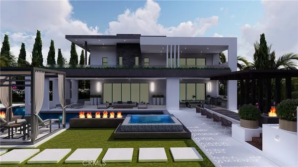 a view of a house with swimming pool and sitting area