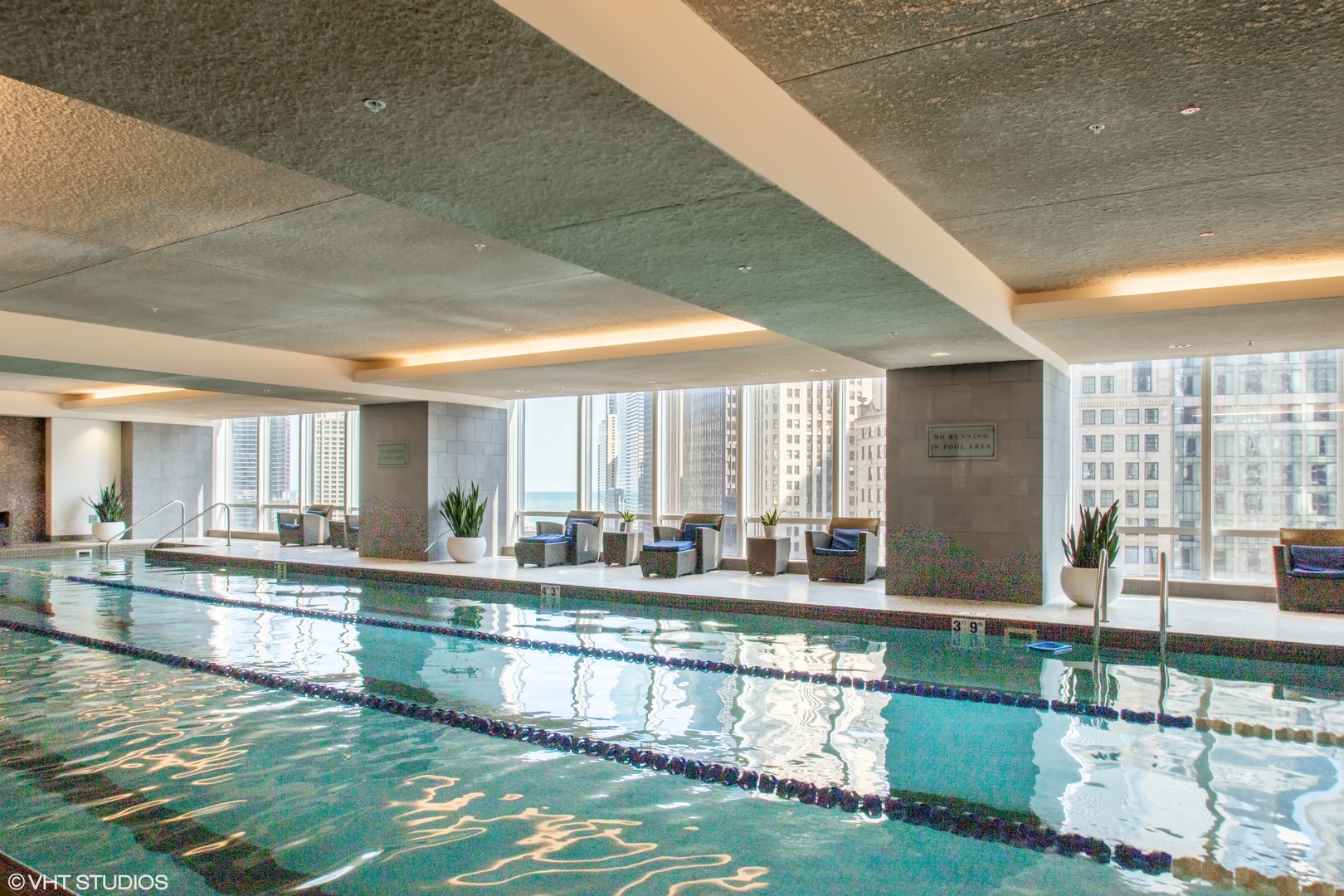 401 North Wabash Avenue, Unit 2526 Chicago, IL 60611 - Photo 19 of 19 a large swimming pool that has a lot of cabinets and a couch