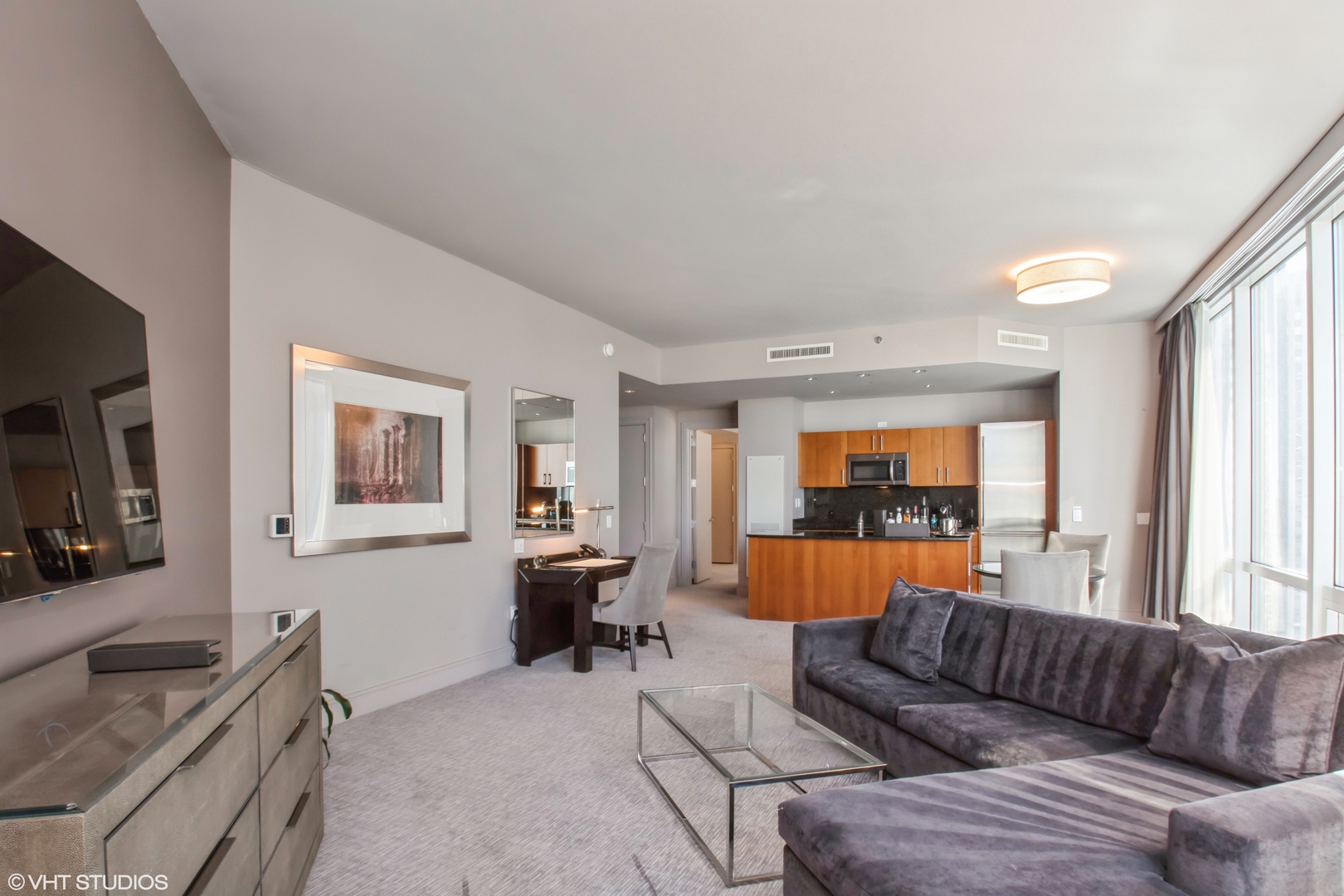 401 North Wabash Avenue, Unit 2526 Chicago, IL 60611 - Photo 5 of 19 a living room with furniture and a flat screen tv