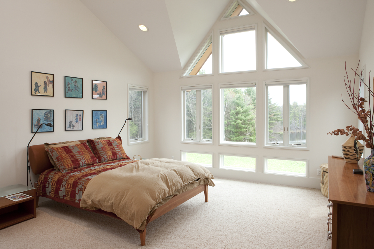 72 A Brett Road Monterey, MA 01245 - Photo 15 of 20 a bedroom with a large bed and a large window