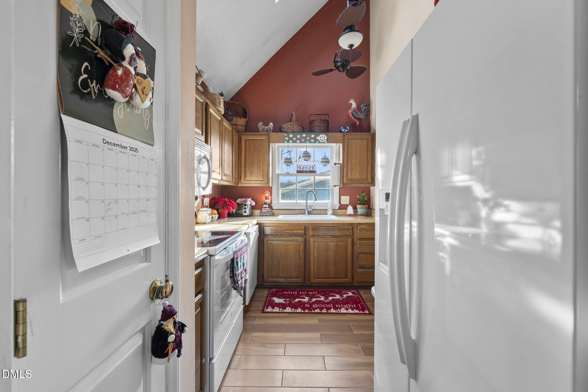 207 South Adams Street Durham, NC 27703 - Photo 14 of 49 a kitchen with a refrigerator and a stove