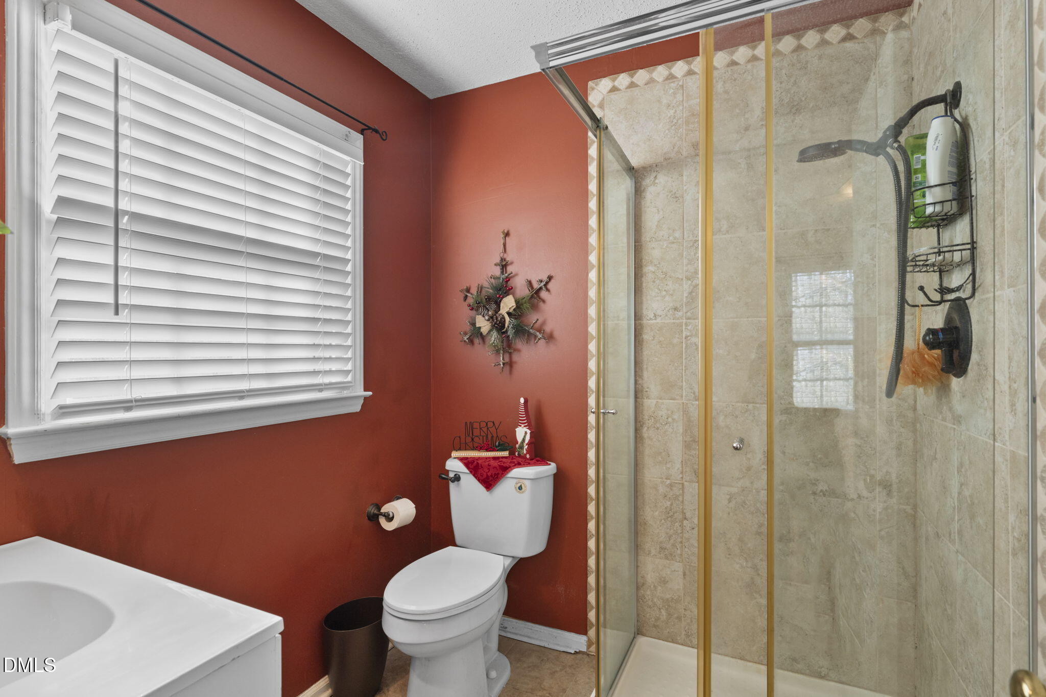 207 South Adams Street Durham, NC 27703 - Photo 18 of 49 a bathroom with a toilet a sink and a shower