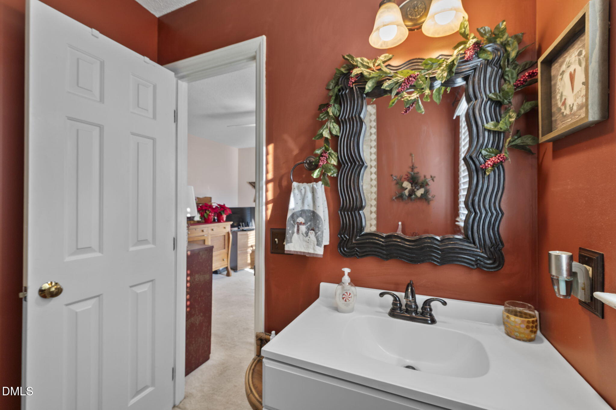 207 South Adams Street Durham, NC 27703 - Photo 19 of 49 a bathroom with a sink and a mirror