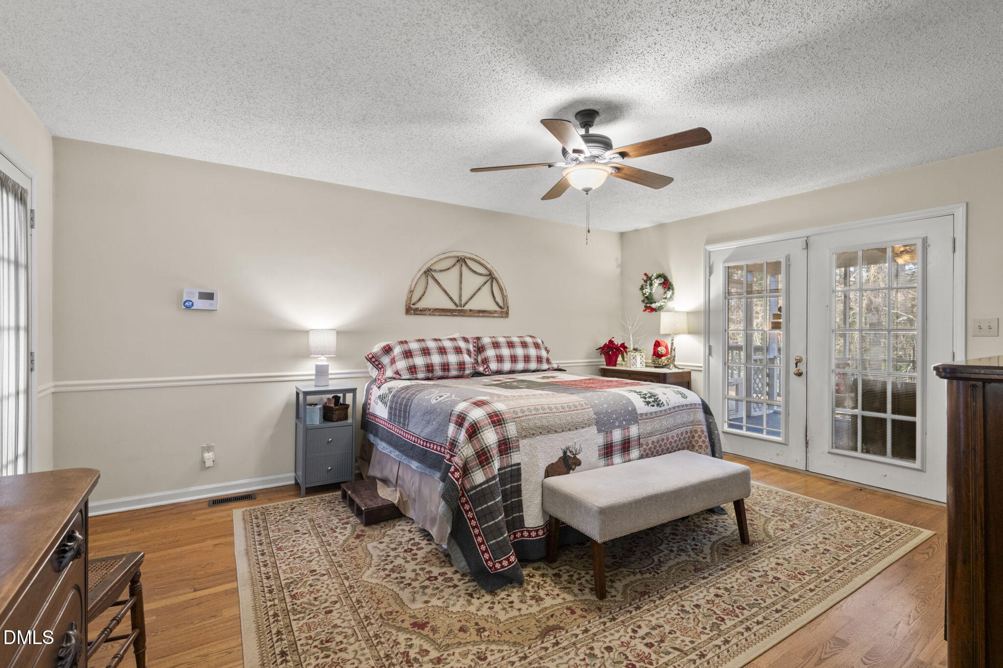 207 South Adams Street Durham, NC 27703 - Photo 25 of 49 a bedroom with a bed rug and window