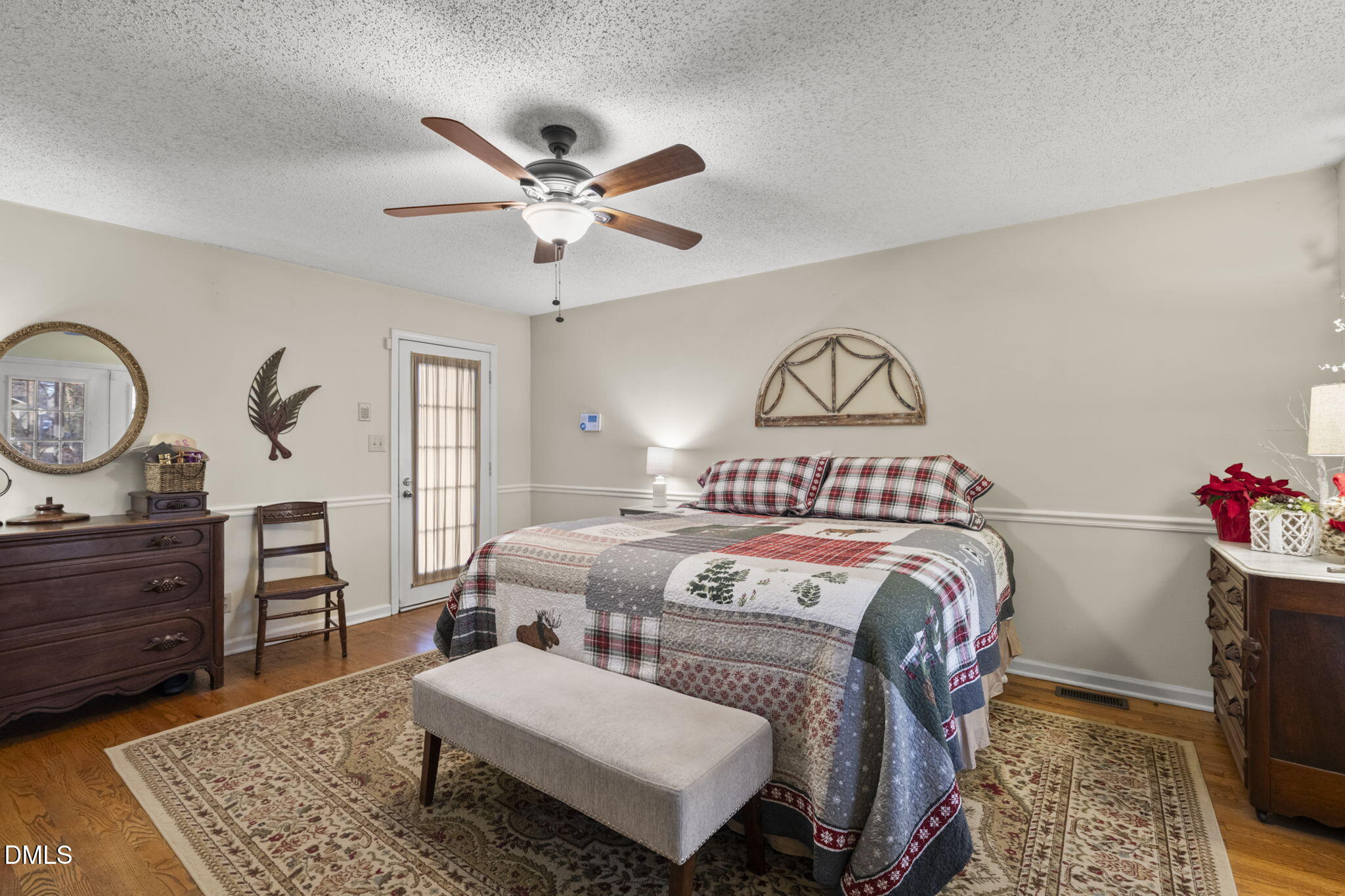207 South Adams Street Durham, NC 27703 - Photo 26 of 49 a living room with furniture a chandelier and a dresser