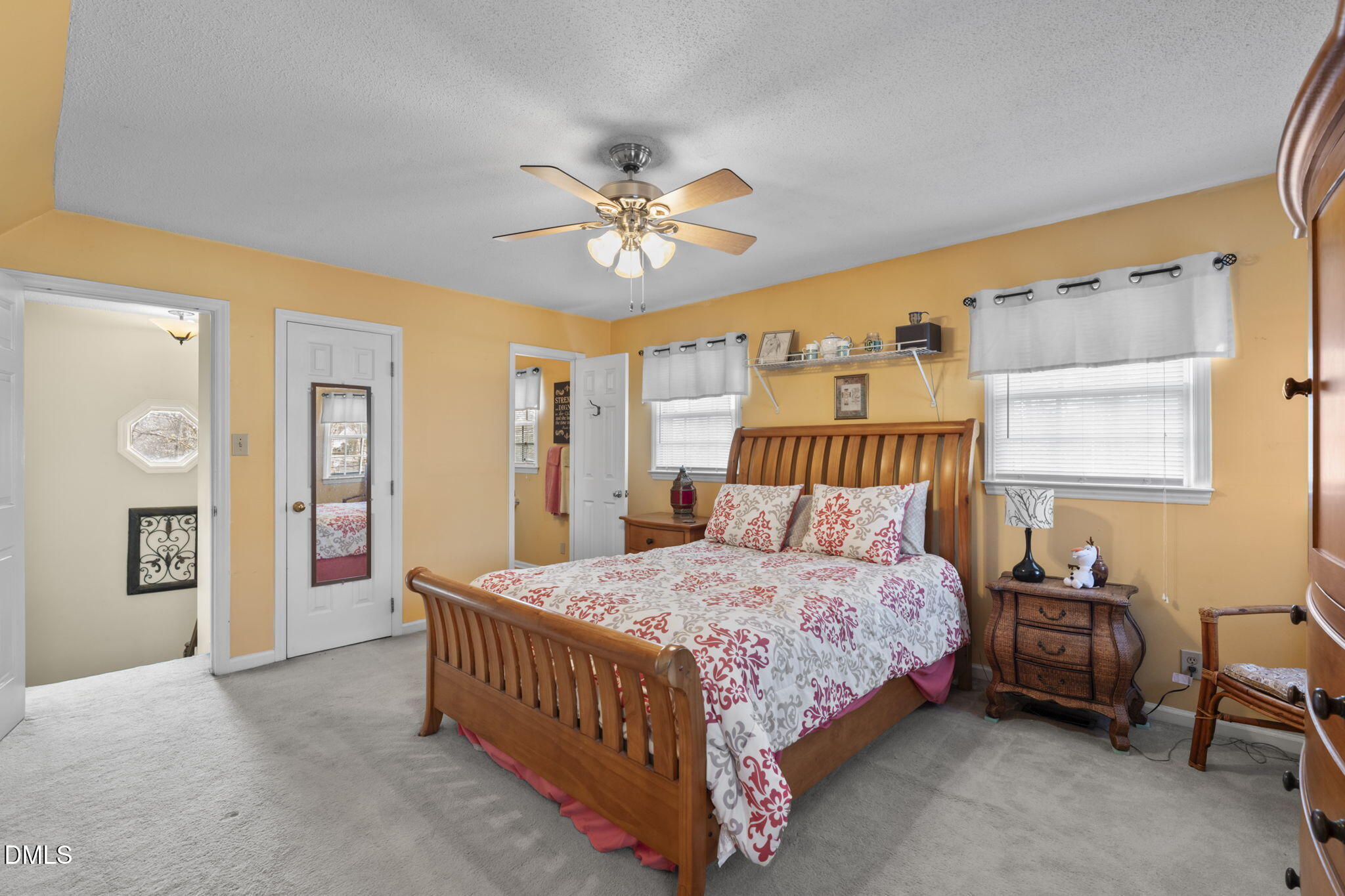 207 South Adams Street Durham, NC 27703 - Photo 29 of 49 a bedroom with a bed and a chandelier