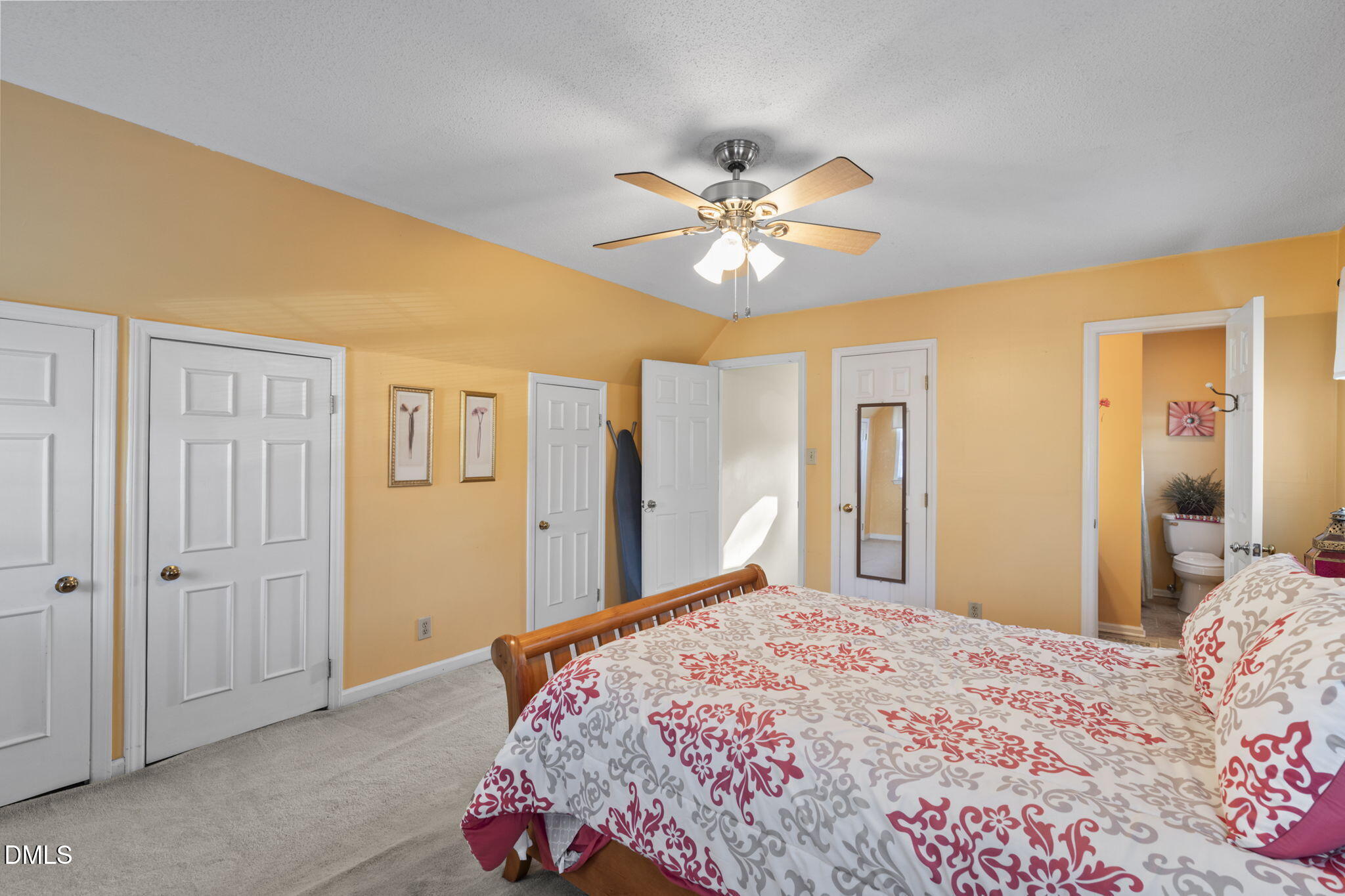 207 South Adams Street Durham, NC 27703 - Photo 32 of 49 a bedroom with a bed and a chandelier