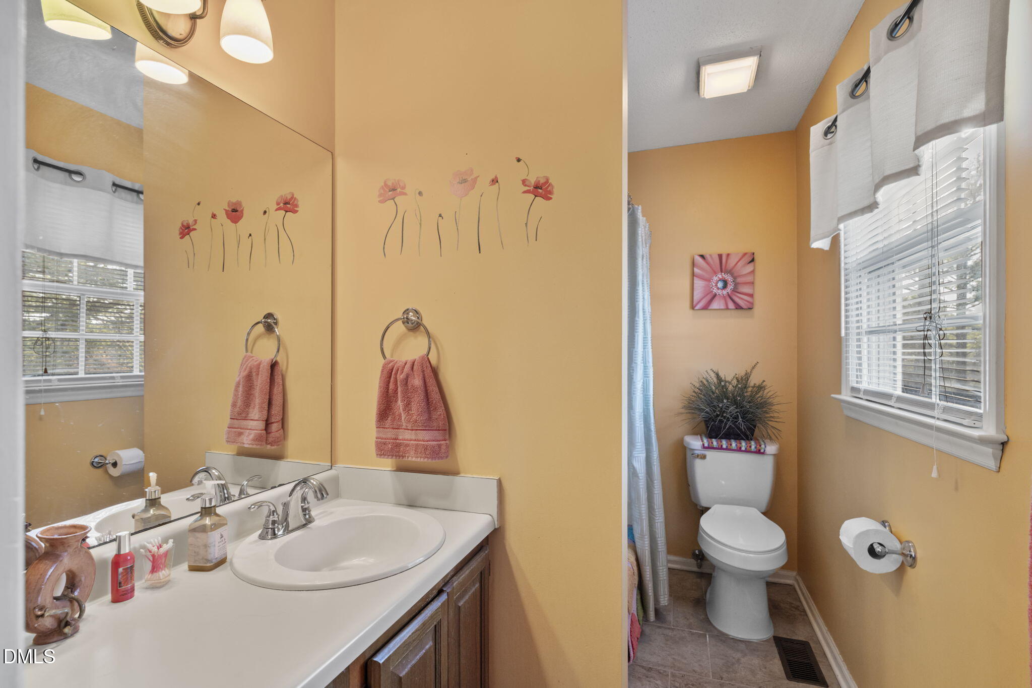 207 South Adams Street Durham, NC 27703 - Photo 33 of 49 a bathroom with a sink vanity mirror and toilet