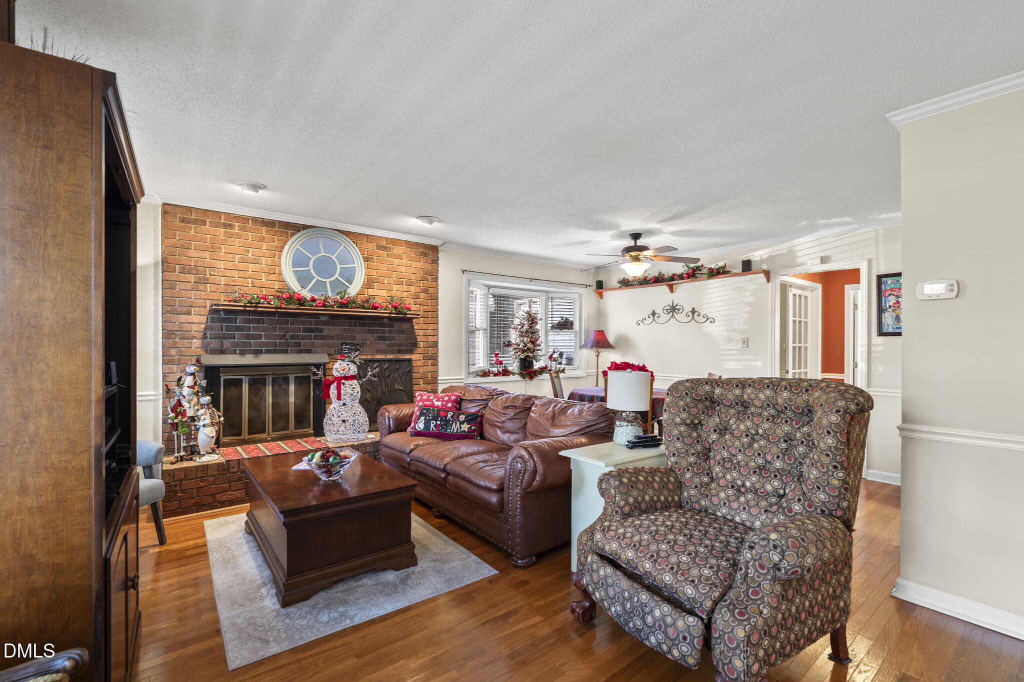 207 South Adams Street Durham, NC 27703 - Photo 7 of 49 a living room with fireplace furniture and a flat screen tv