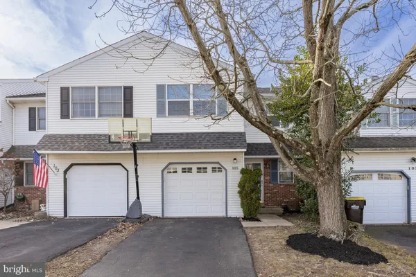 a front view of a house with yard
