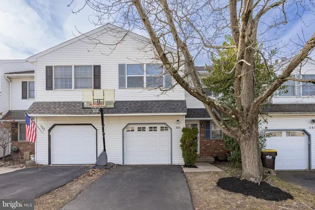 a front view of a house with yard