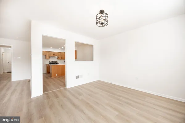 a view of a kitchen with wooden floor