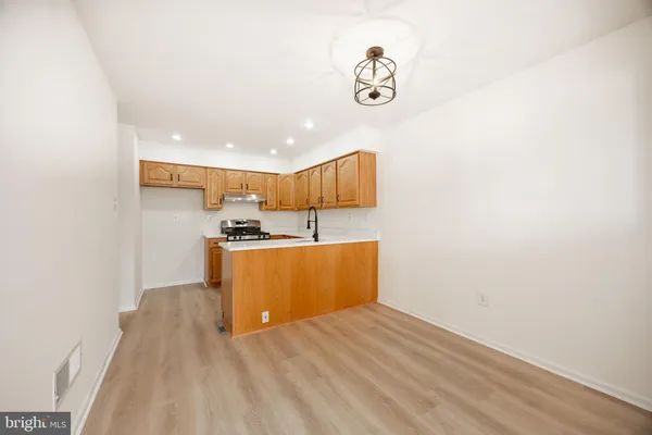 a view of kitchen with cabinets