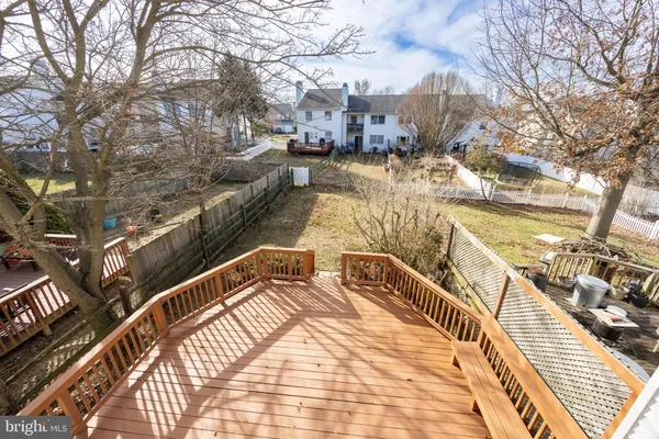 a view of a balcony with two chairs and a table