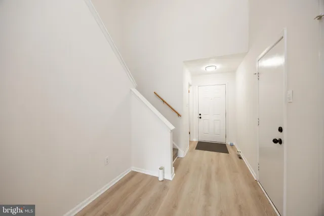 a view of a hallway with white walls