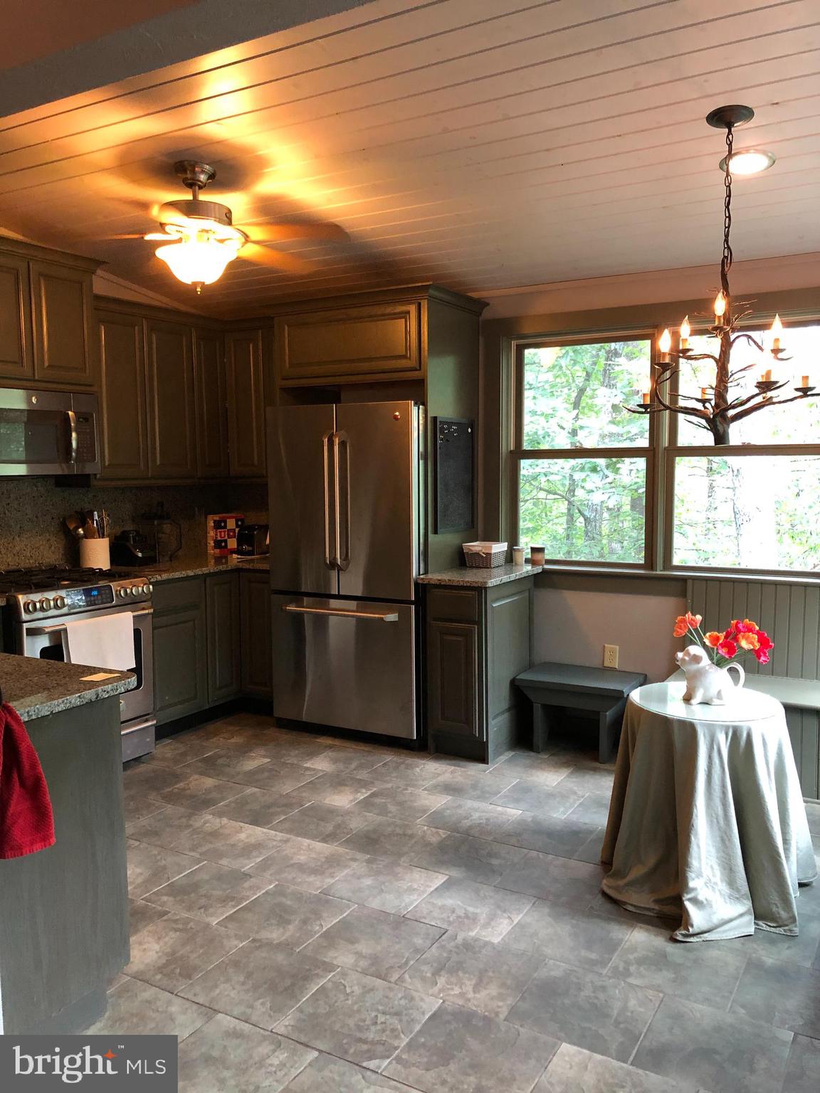 42 Pearl Place Basye, VA 22842 - Photo 11 of 30 a kitchen with granite countertop a sink stainless steel appliances and cabinets