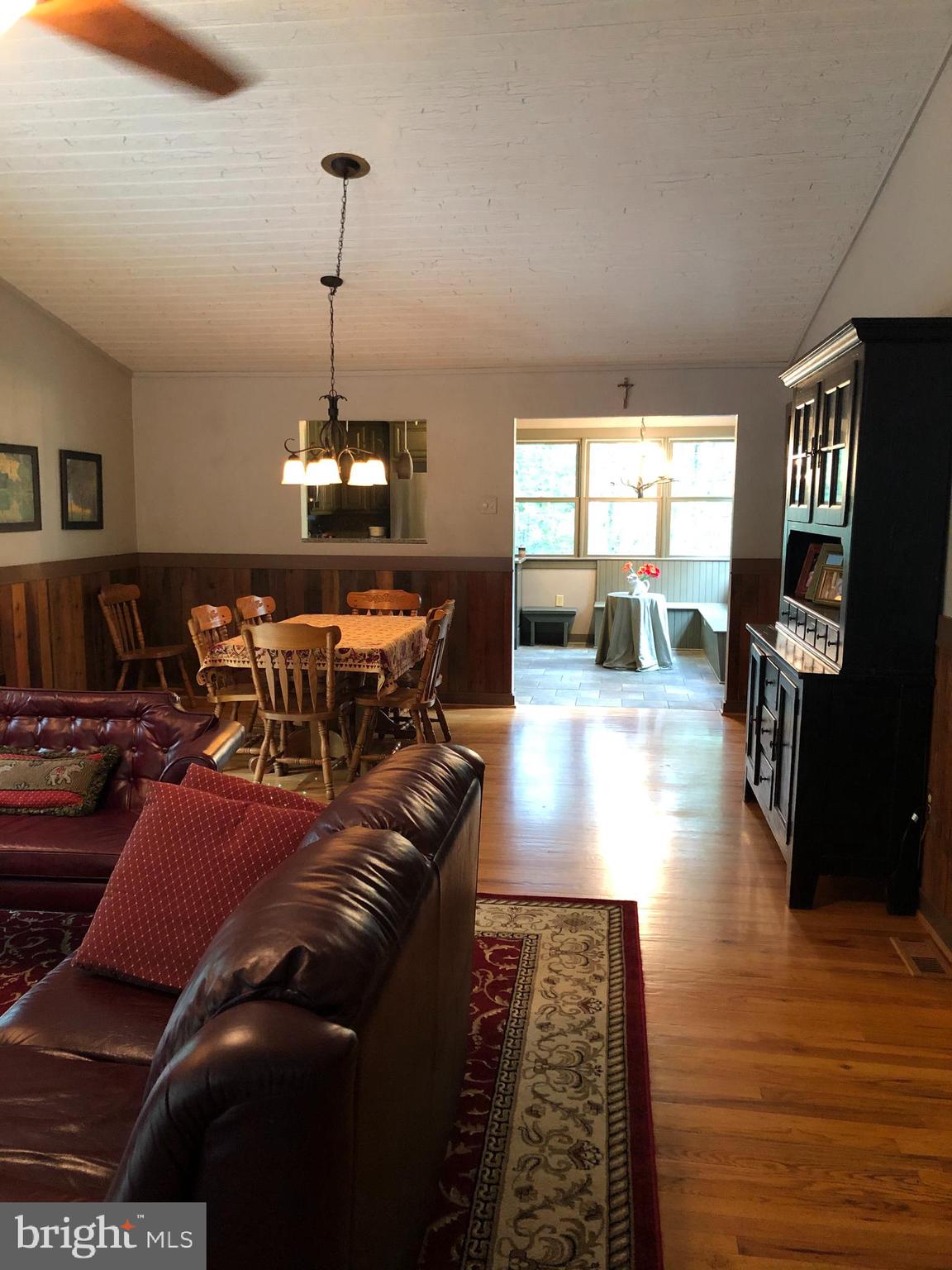 42 Pearl Place Basye, VA 22842 - Photo 12 of 30 a living room with furniture a rug and a chandelier