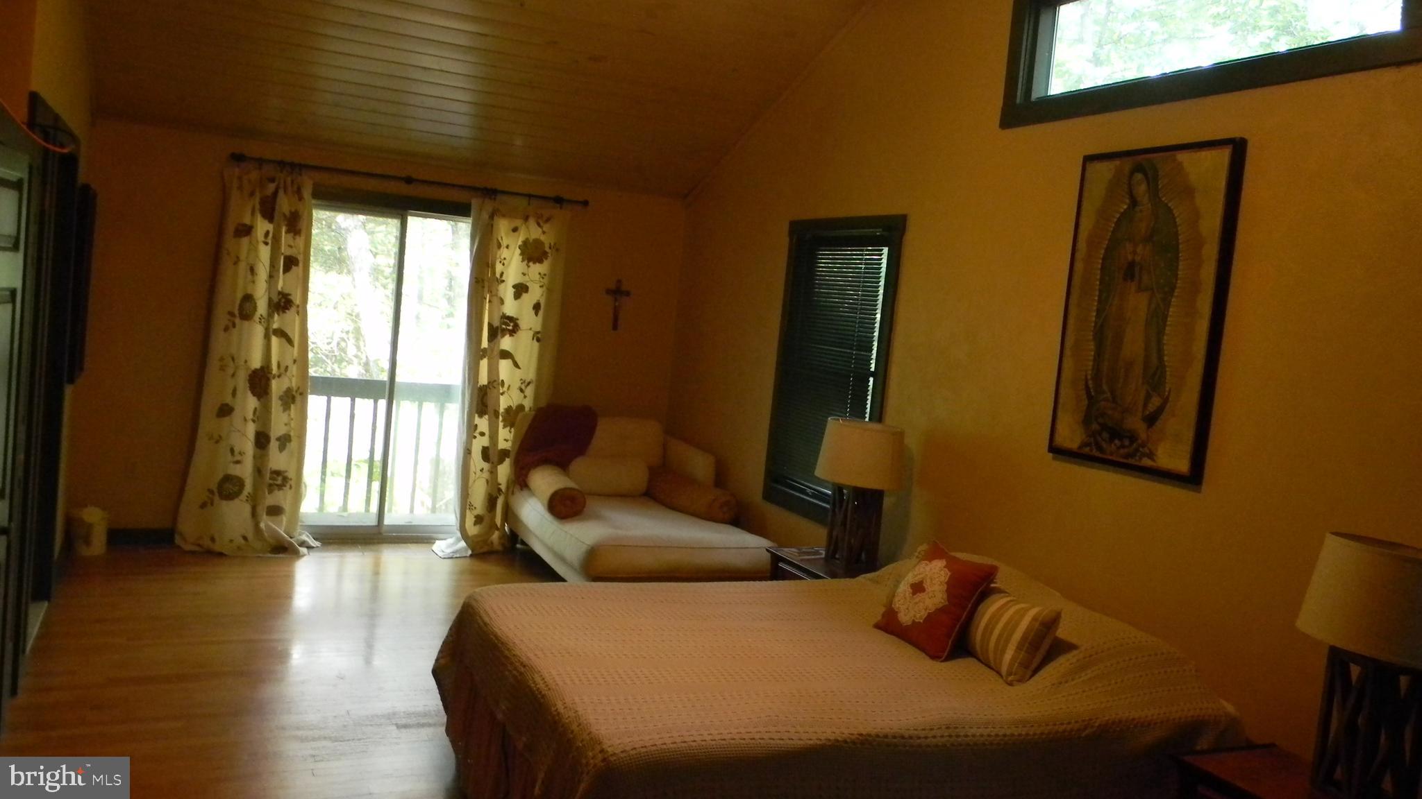 42 Pearl Place Basye, VA 22842 - Photo 13 of 30 a bedroom with a bed and wooden floor