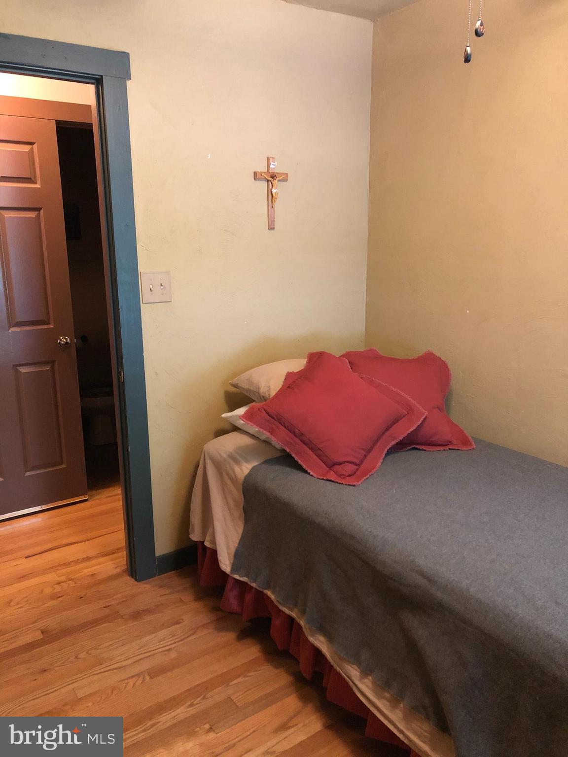 42 Pearl Place Basye, VA 22842 - Photo 17 of 30 a bedroom with a bed and a mirror