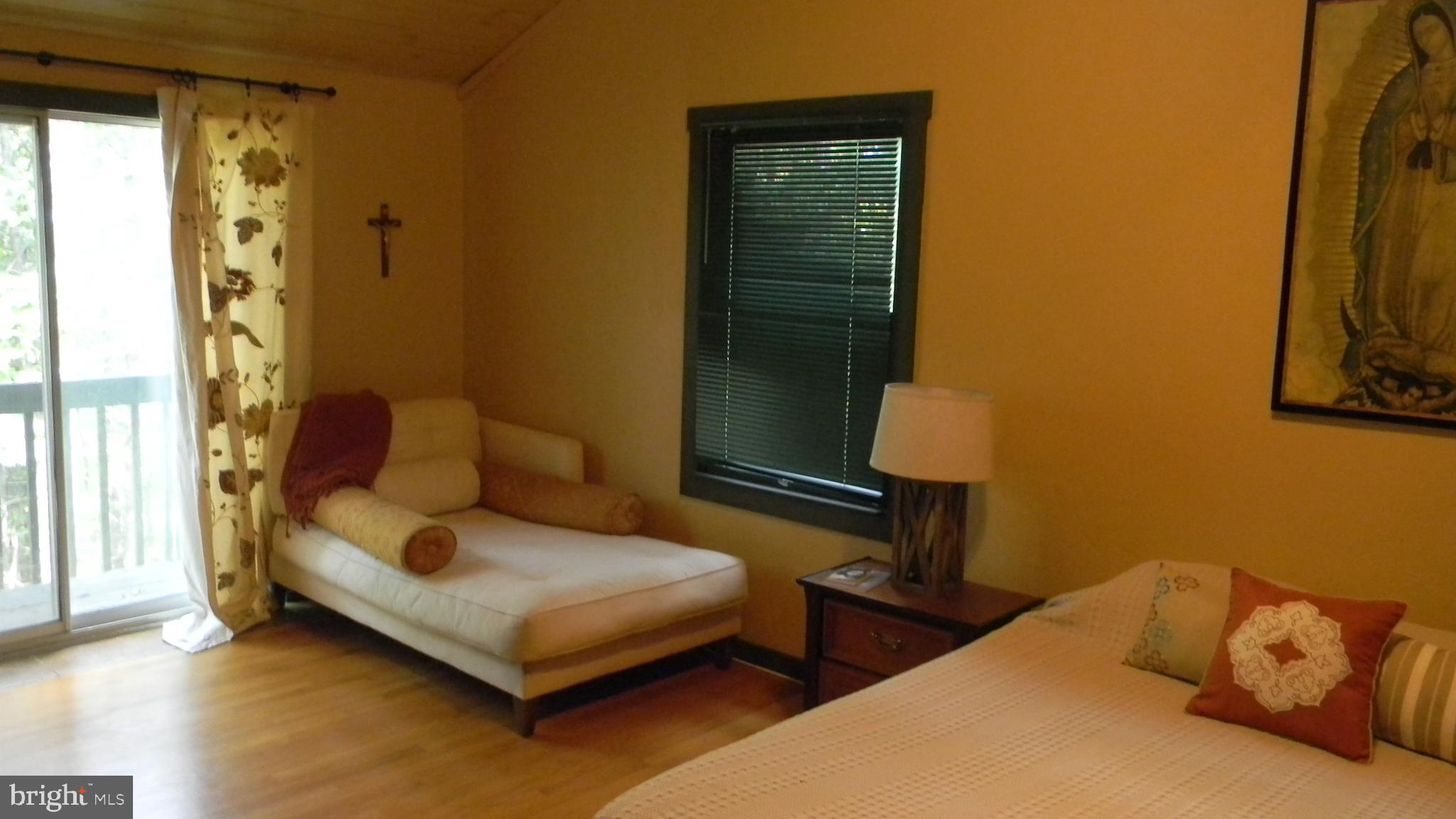 42 Pearl Place Basye, VA 22842 - Photo 18 of 30 a bedroom with a bed and a window