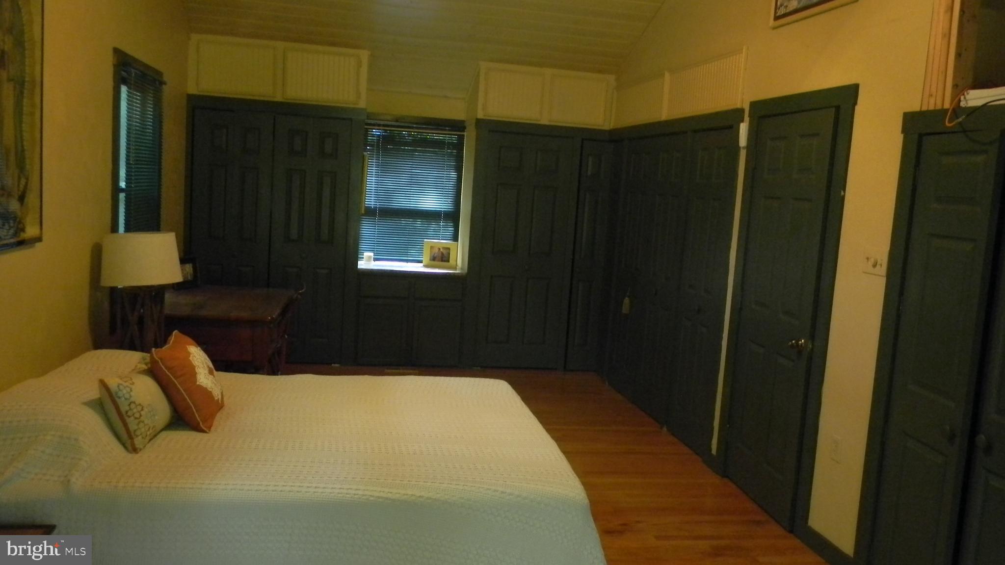 42 Pearl Place Basye, VA 22842 - Photo 19 of 30 a bedroom with a bed and a mirror