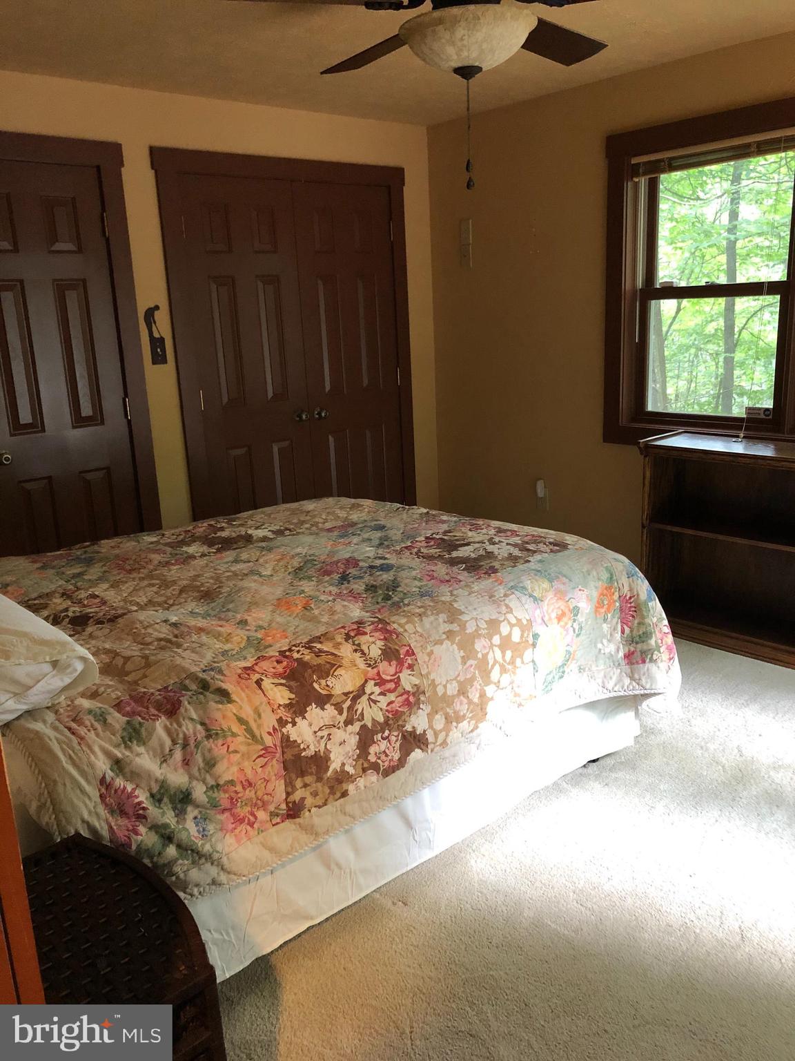 42 Pearl Place Basye, VA 22842 - Photo 22 of 30 a bedroom with a bed and a window