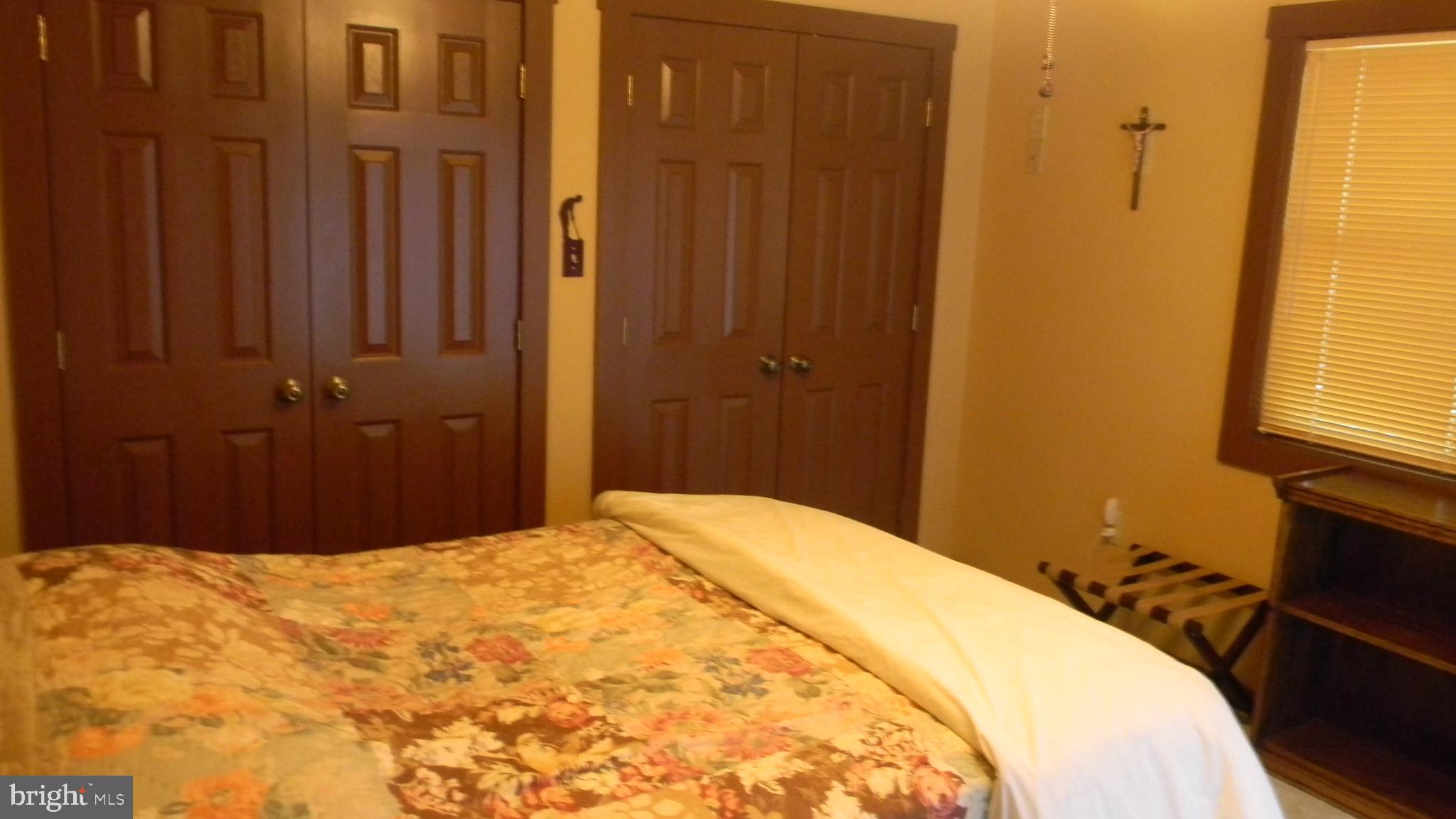 42 Pearl Place Basye, VA 22842 - Photo 26 of 30 a bedroom with a bed and a window