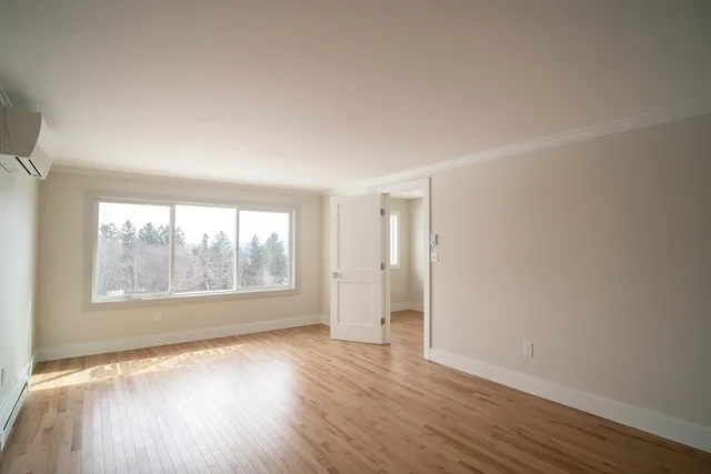 a white toilet sitting next to a shower curtain