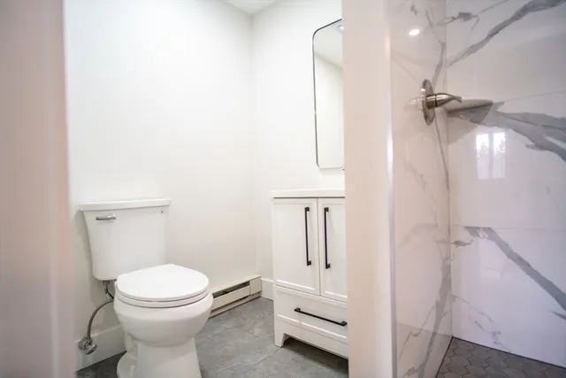 a walk in closet with a white door