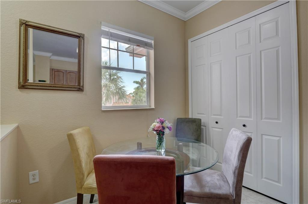 990 Peggy Circle, Unit 404 Naples, FL 34113 - Photo 11 of 26 a dining room with furniture and window