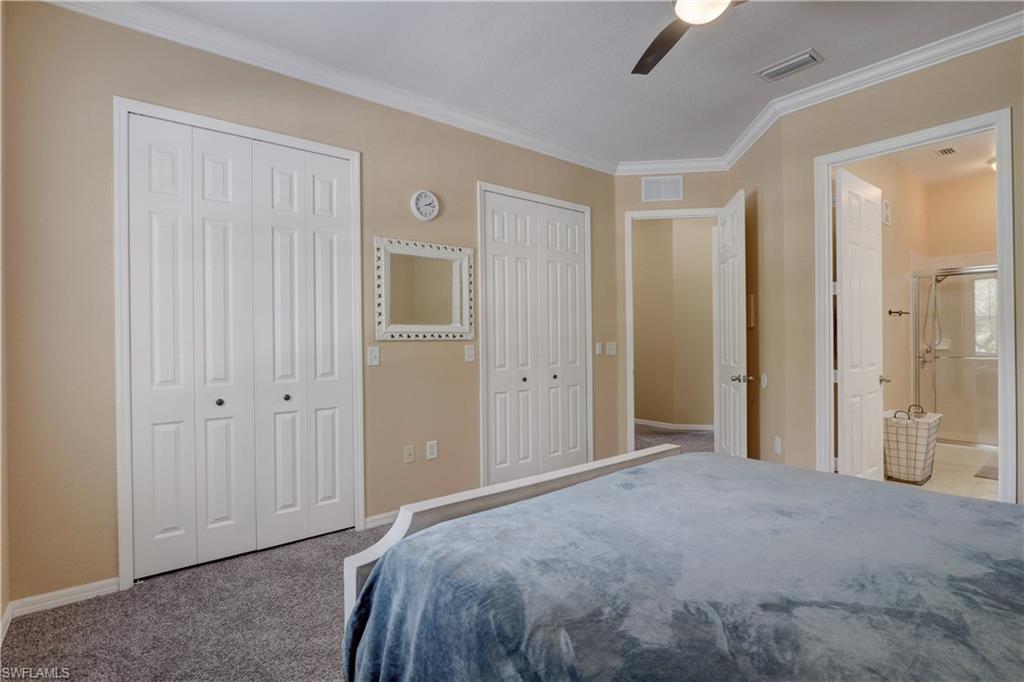 990 Peggy Circle, Unit 404 Naples, FL 34113 - Photo 12 of 26 a view of a bedroom with closet area