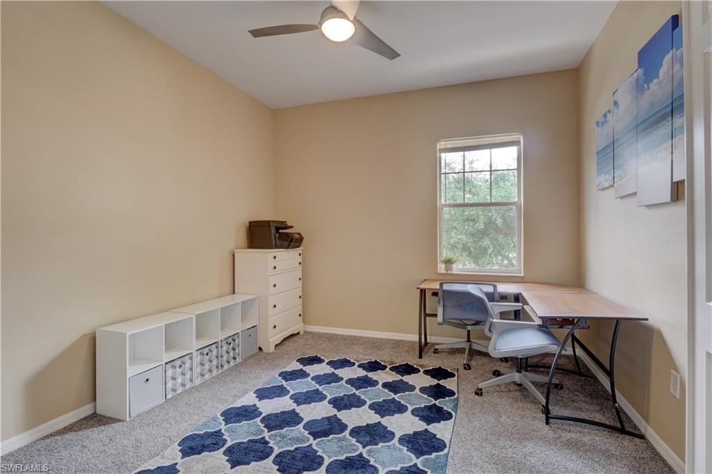 990 Peggy Circle, Unit 404 Naples, FL 34113 - Photo 16 of 26 a bedroom with furniture and a window